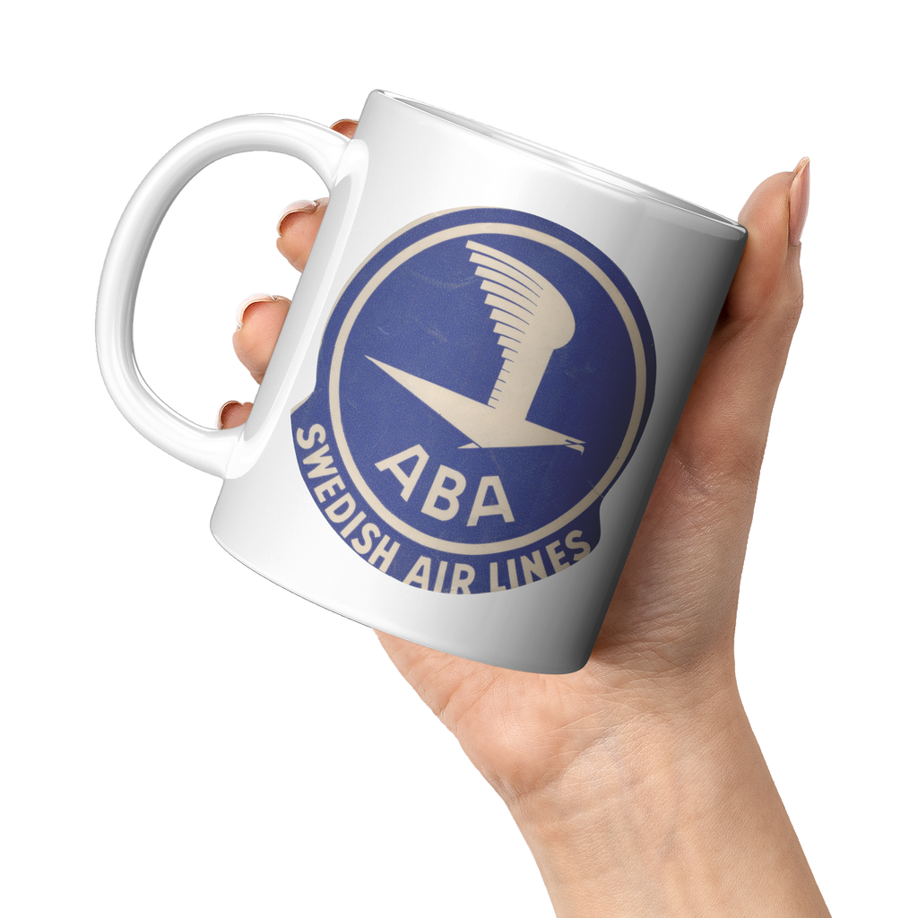 ABA_Swedish_Airlines_Bag_Sticker_Coffee__11oz_White_LH_Model_Mockup.png_15472194