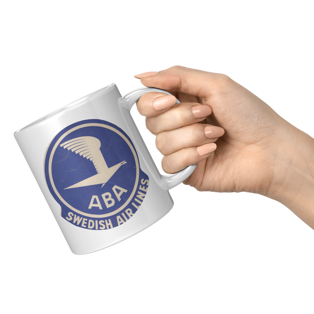 ABA_Swedish_Airlines_Bag_Sticker_Coffee__11oz_White_RH_Model_Mockup.png_15472196