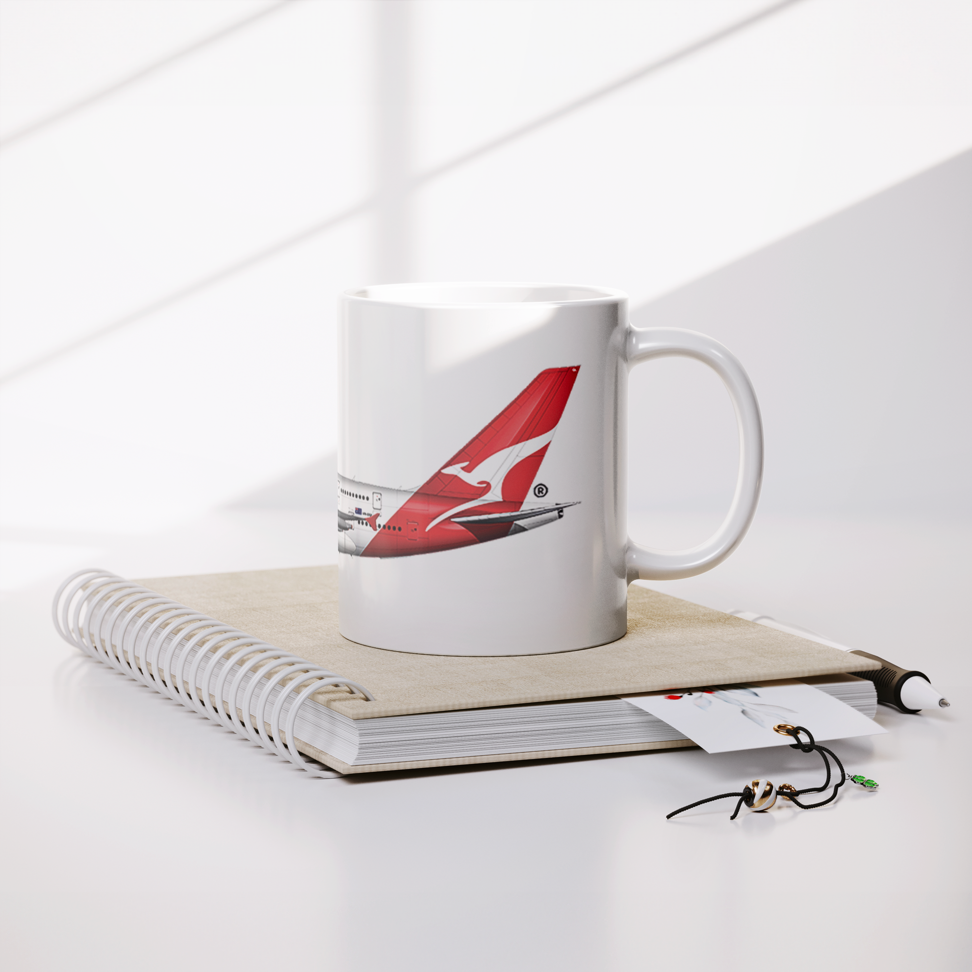 QANTAS_A380_Coffee_Mug_Lifestyle_Notebook_Mockup.png